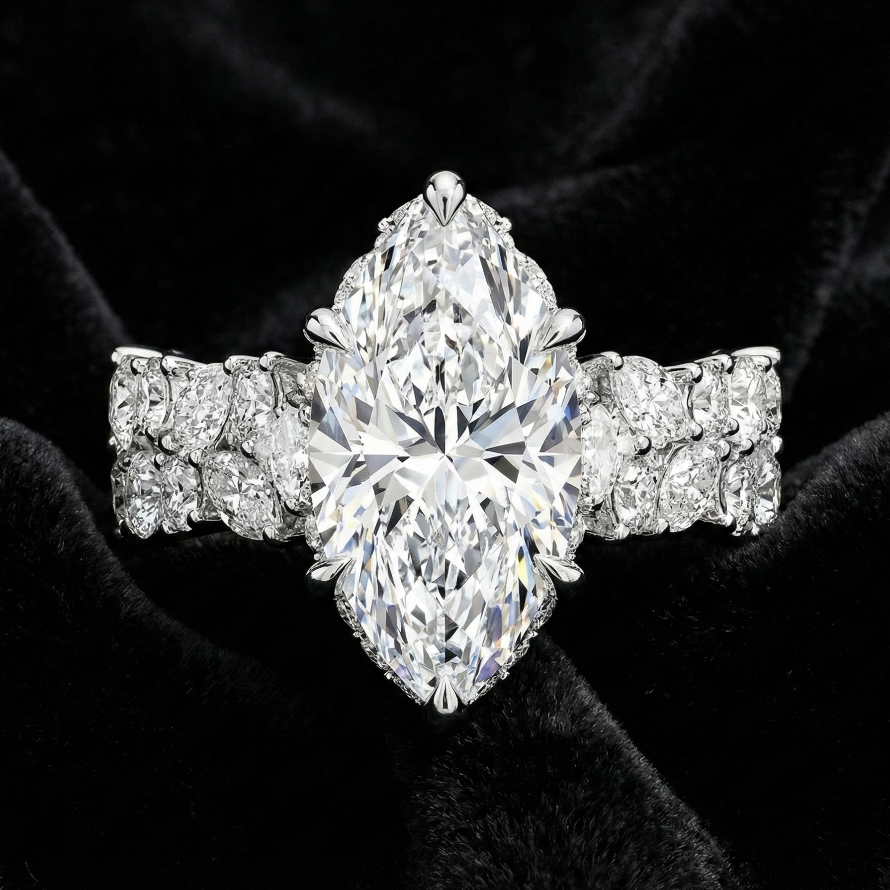 Diamond ring with a marquise-shaped center stone on a black velvet background
